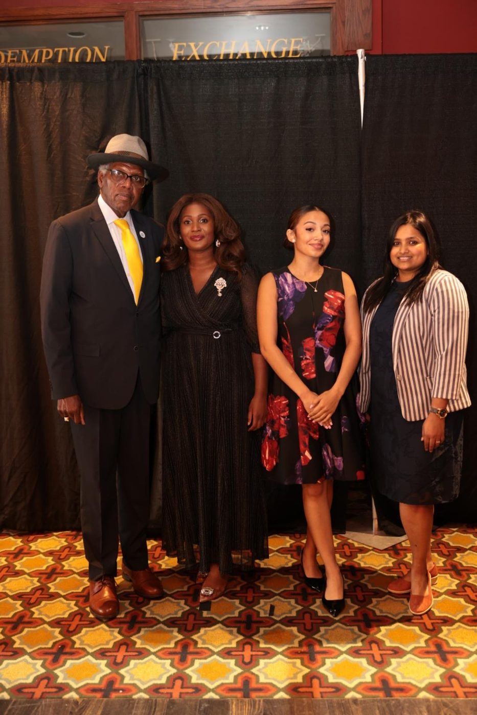 Vanguard graduates with an honored guest